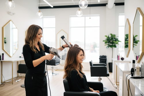 Professional blowout and hair styling at a beauty salon
